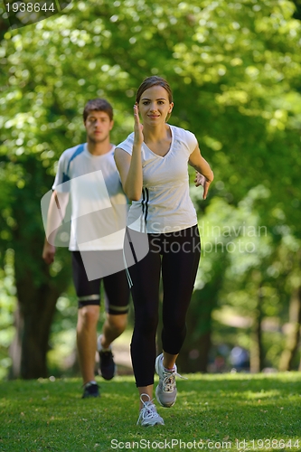 Image of Young couple jogging