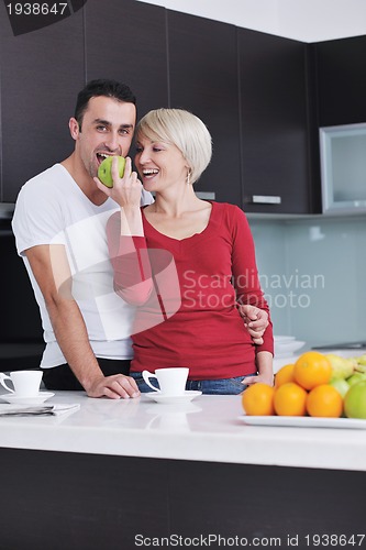 Image of young couple have fun in modern kitchen