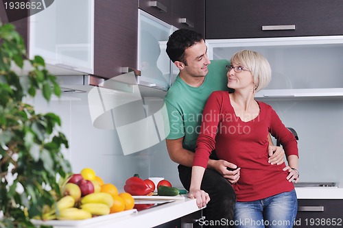 Image of young couple have fun in modern kitchen