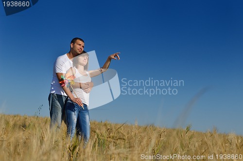 Image of happy couple in wheat field