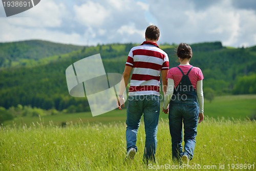 Image of romantic young couple in love together outdoor
