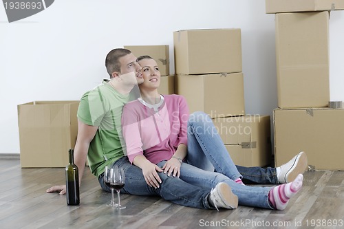 Image of Young couple moving in new home