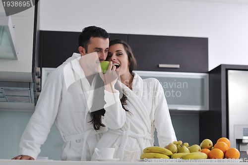 Image of young couple have fun in modern kitchen