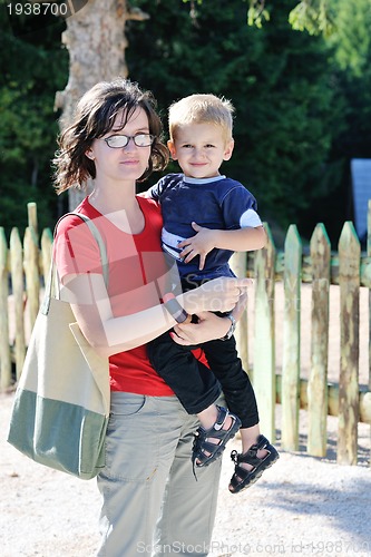 Image of woman and child have fun outdoor