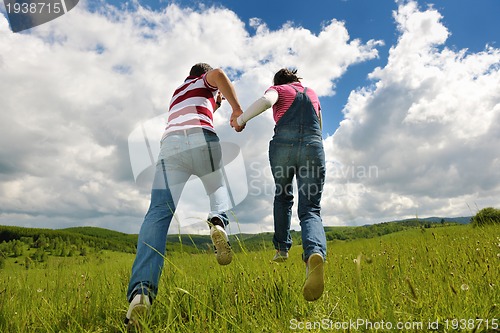 Image of romantic young couple in love together outdoor