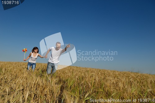 Image of happy couple in wheat field