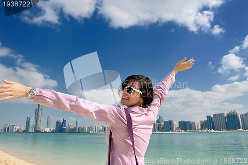 Image of happy tourist woman