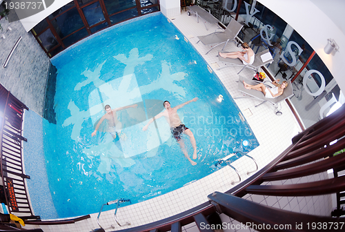 Image of yung people group at spa swimming pool