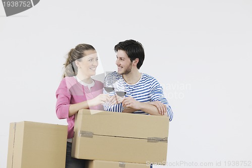 Image of Young couple moving in new home