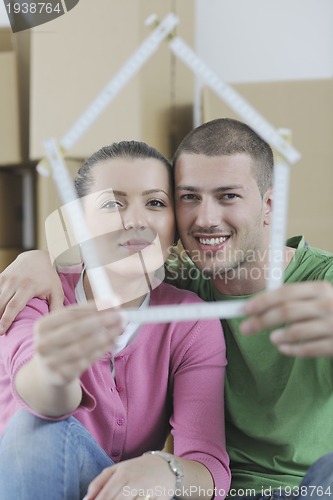 Image of Young couple moving in new home