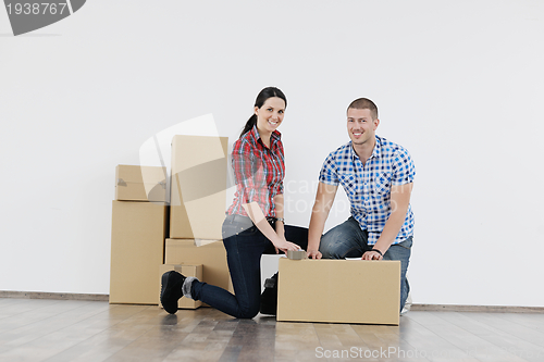 Image of Young couple moving in new house