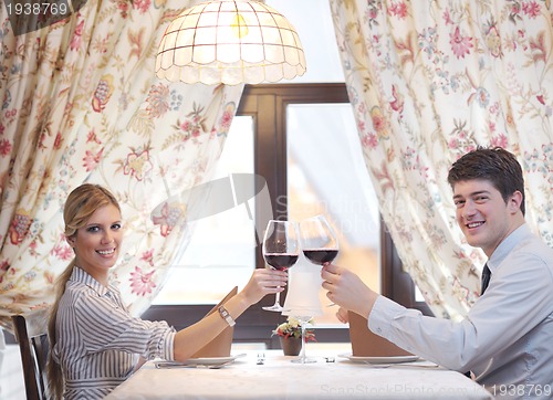 Image of young couple having dinner at a restaurant