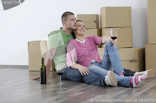 Image of Young couple moving in new home