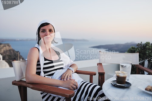 Image of Greek woman on the streets of Oia, Santorini, Greece