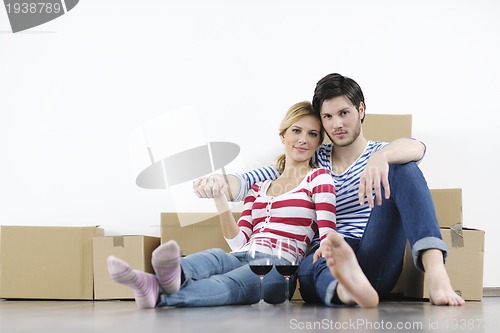 Image of Young couple moving in new home