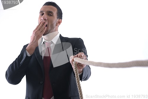 Image of business man with rope isolated on white background