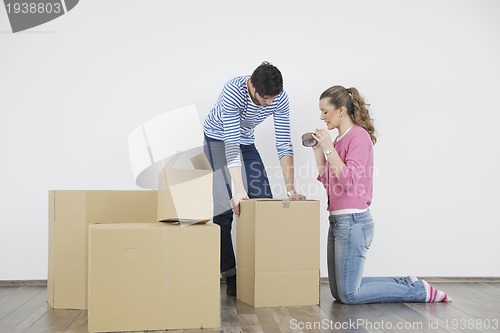 Image of Young couple moving in new home