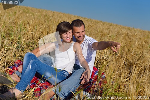 Image of happy couple in wheat field