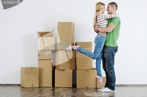 Image of Young couple moving in new house