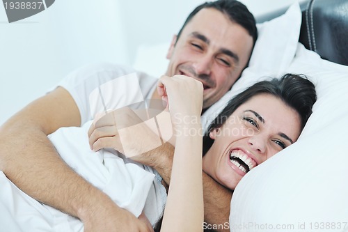 Image of young couple have good time in their bedroom