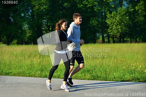 Image of Young couple jogging