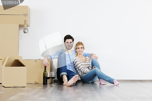 Image of Young couple moving in new house
