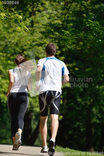 Image of Young couple jogging