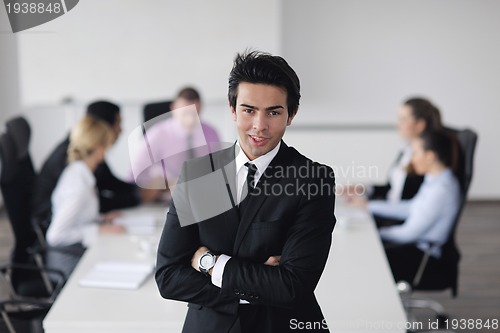 Image of young business man at meeting