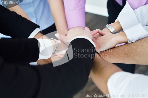 Image of business people group joining hands