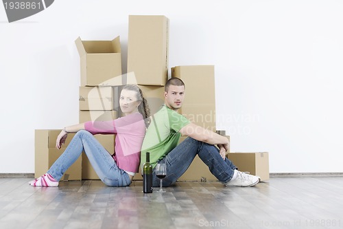 Image of Young couple moving in new home