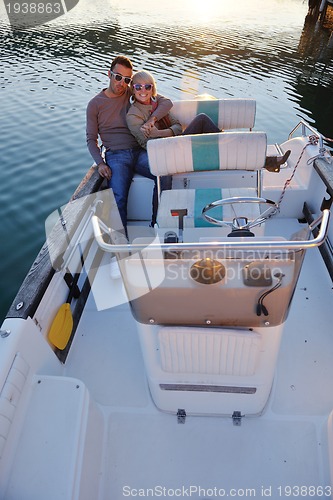 Image of couple in love  have romantic time on boat