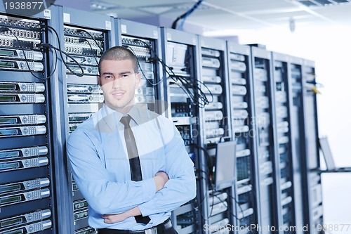 Image of young it engeneer in datacenter server room