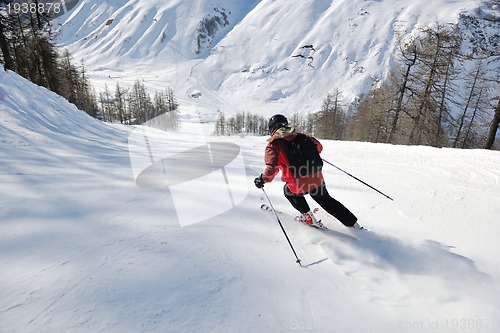 Image of skiing on fresh snow at winter season at beautiful sunny day