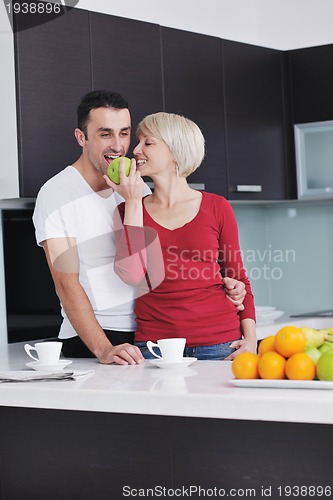 Image of young couple have fun in modern kitchen