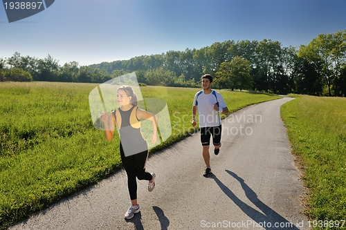 Image of Young couple jogging