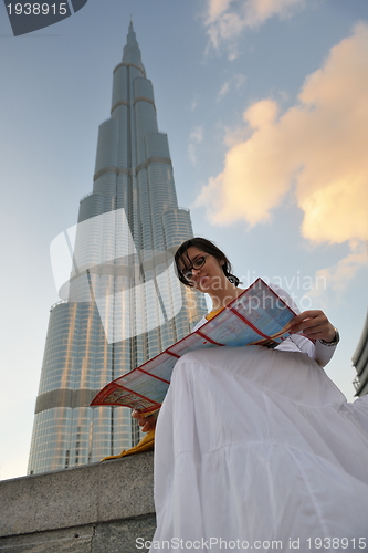 Image of happy tourist woman