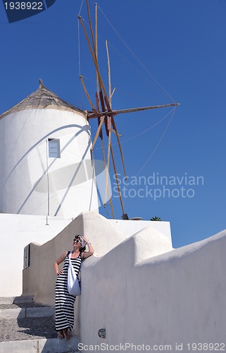 Image of Greek woman on the streets of Oia, Santorini, Greece