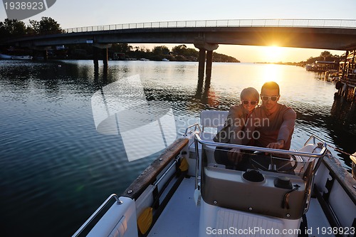 Image of couple in love  have romantic time on boat