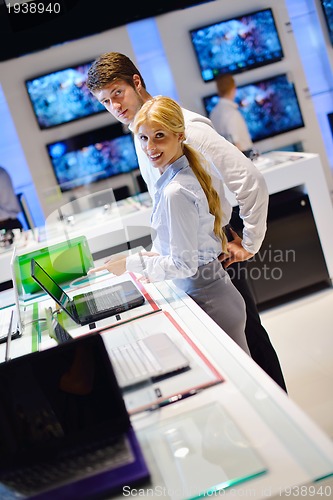 Image of people buy  in consumer electronics store