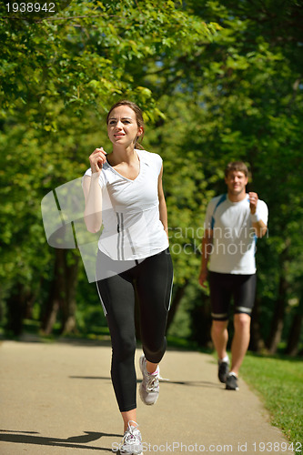 Image of Young couple jogging