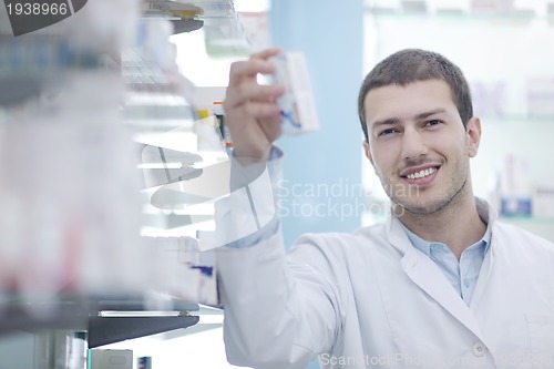Image of pharmacist chemist man in pharmacy drugstore