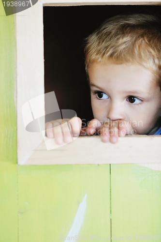 Image of happy child in a window