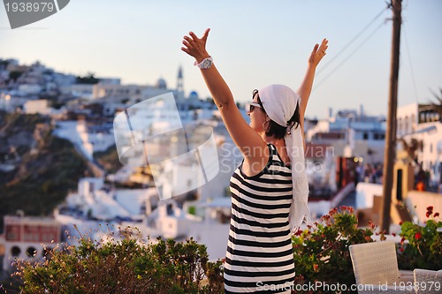 Image of Greek woman on the streets of Oia, Santorini, Greece