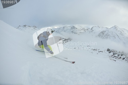 Image of skiing on fresh snow at winter season at beautiful sunny day