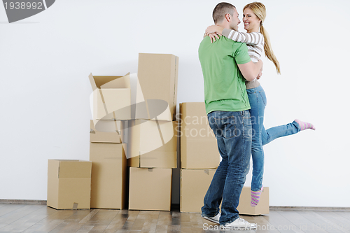 Image of Young couple moving in new house