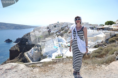 Image of Greek woman on the streets of Oia, Santorini, Greece