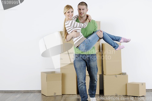 Image of Young couple moving in new home