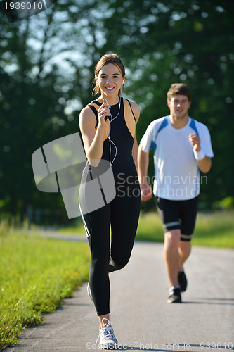 Image of Young couple jogging