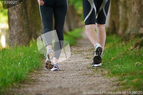 Image of Young couple jogging at morning