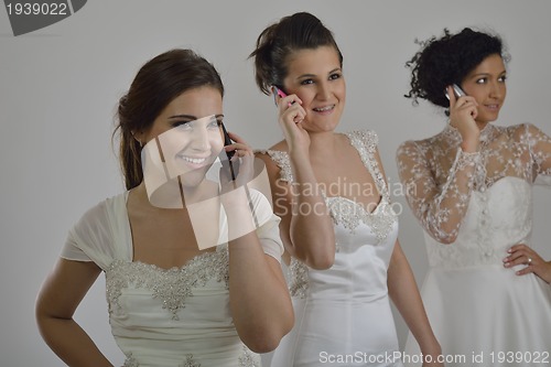 Image of portrait of a three beautiful woman in wedding dress